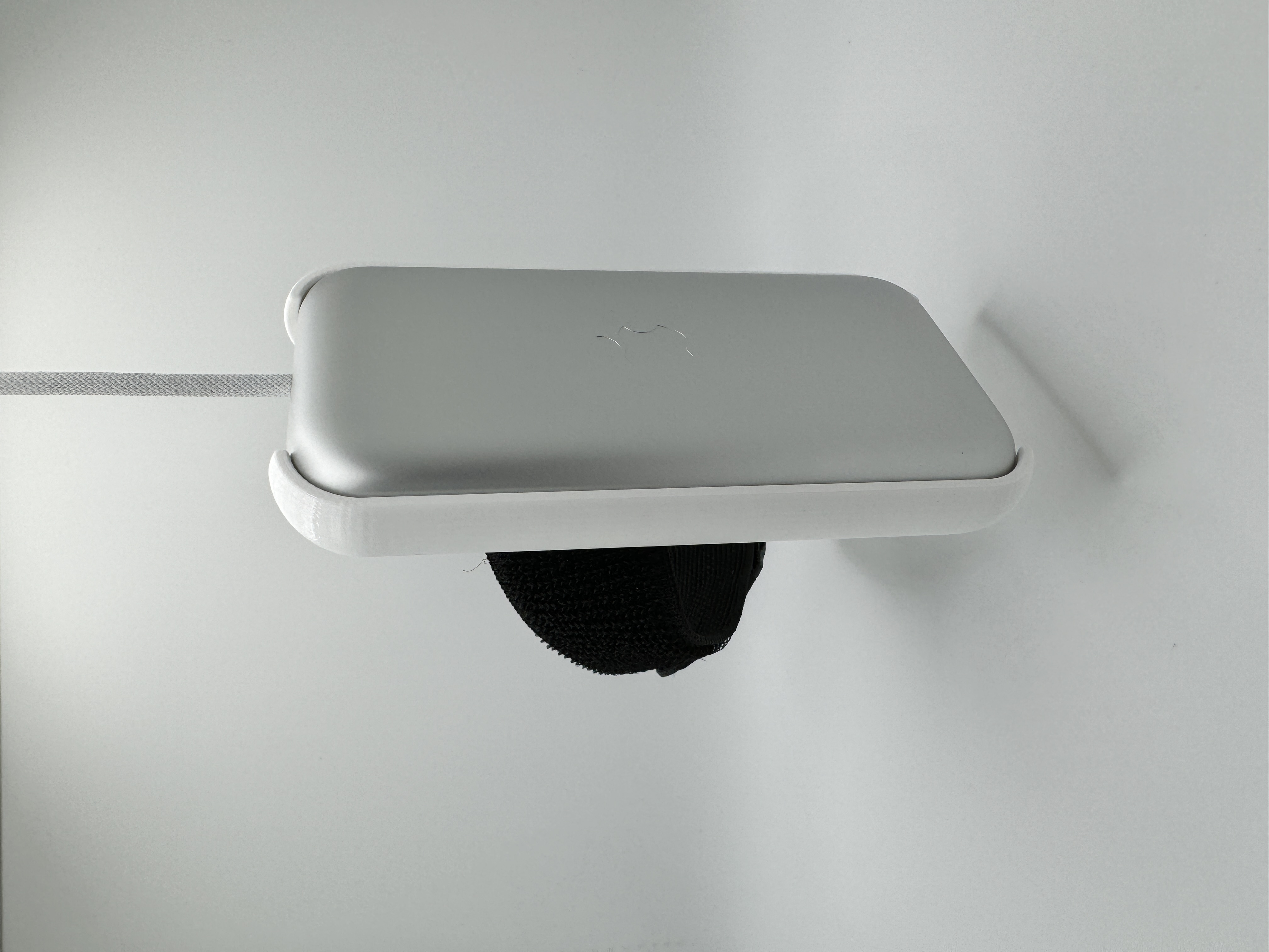 A picture of the battery holder, with battery installed, front view