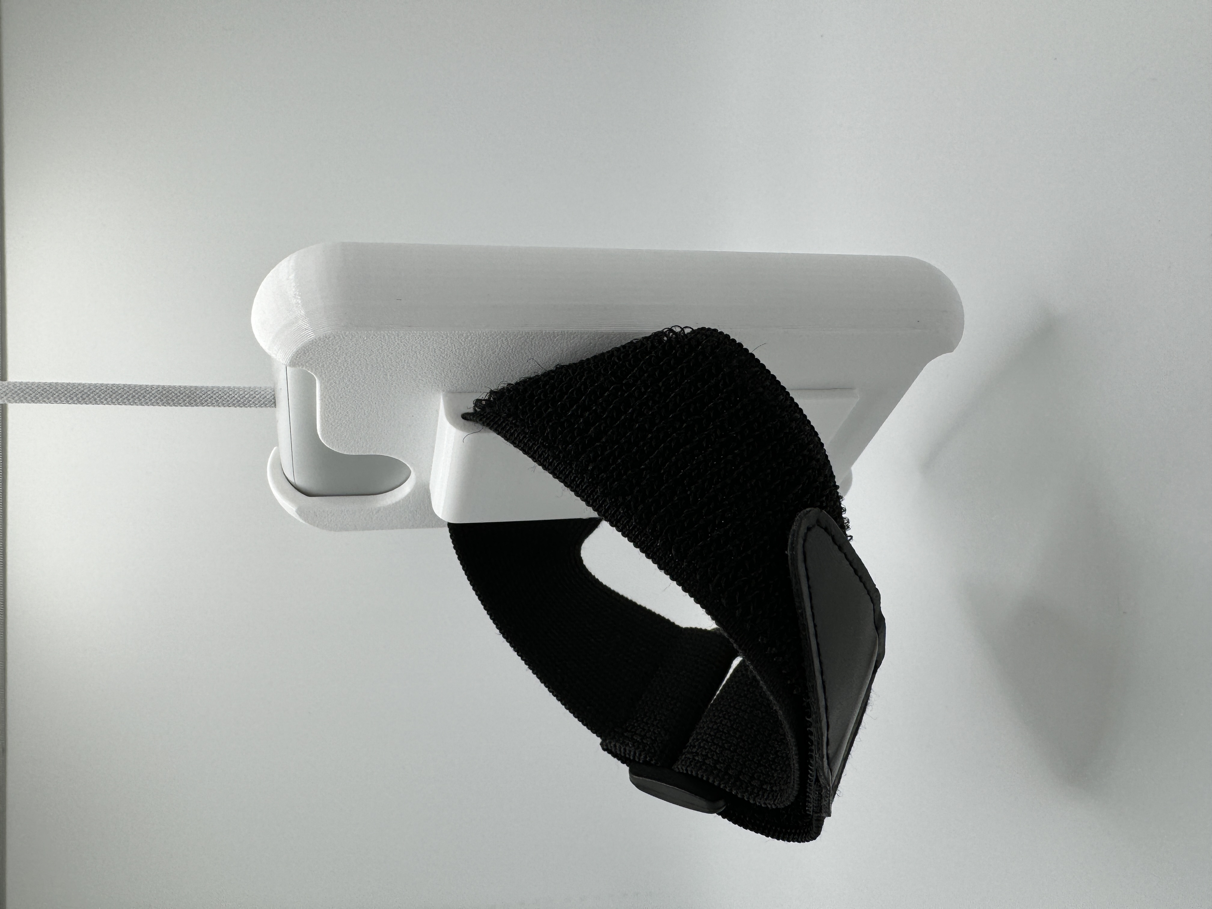 A picture of the battery holder, with battery installed, back view