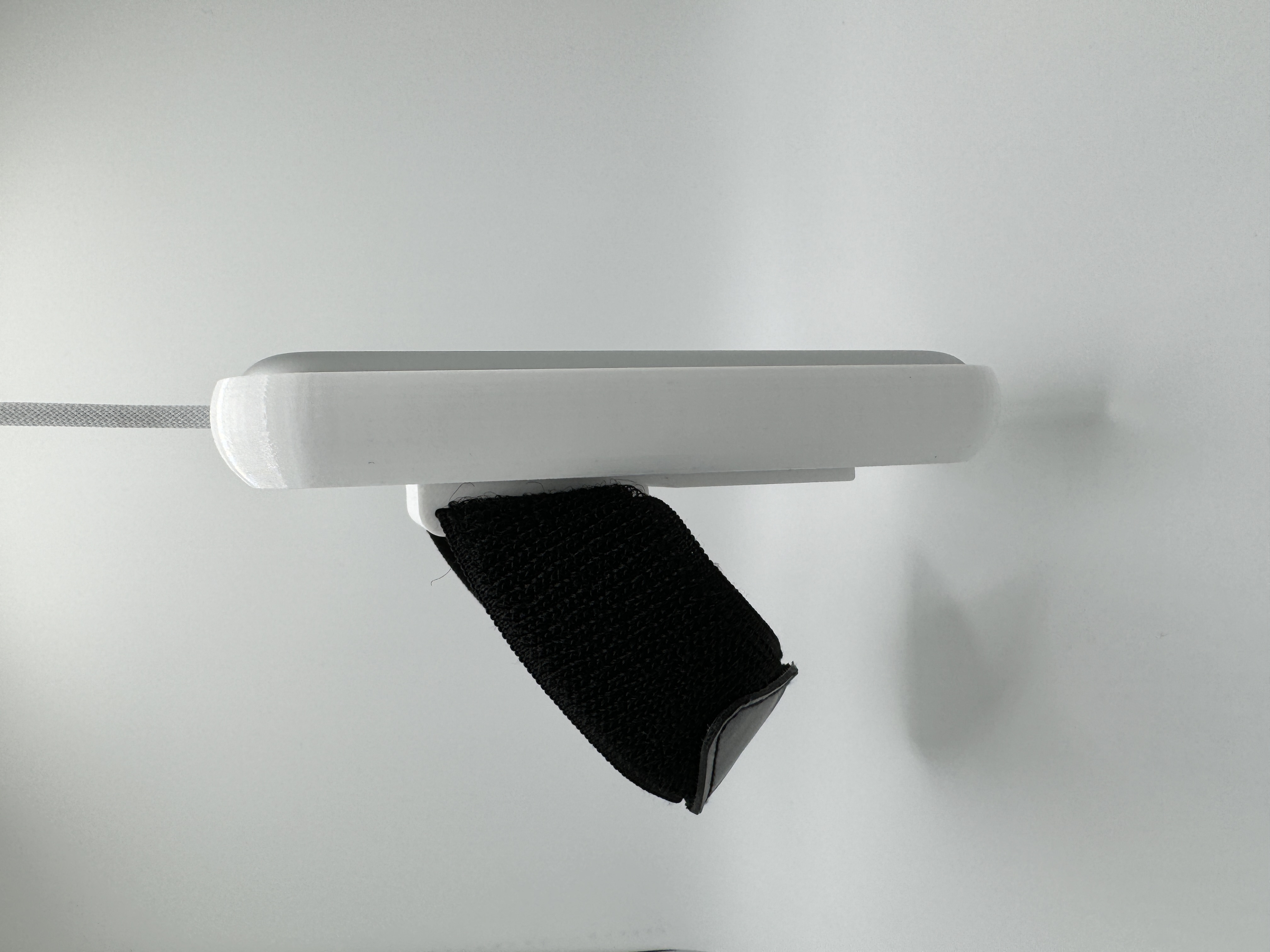 A picture of the battery holder, with battery installed, side view