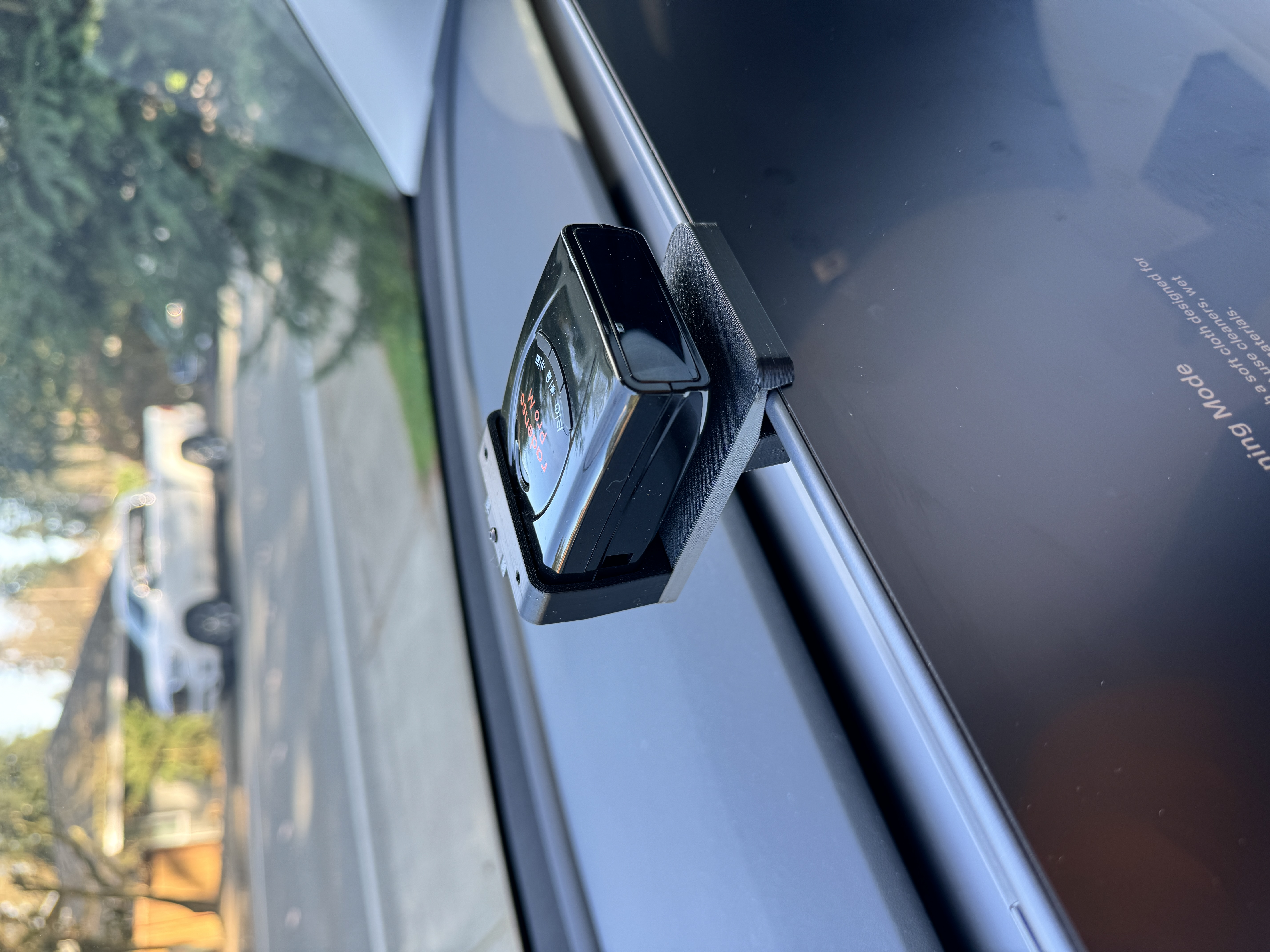 View of the Radenso Pro M installed in the bracket in a Tesla