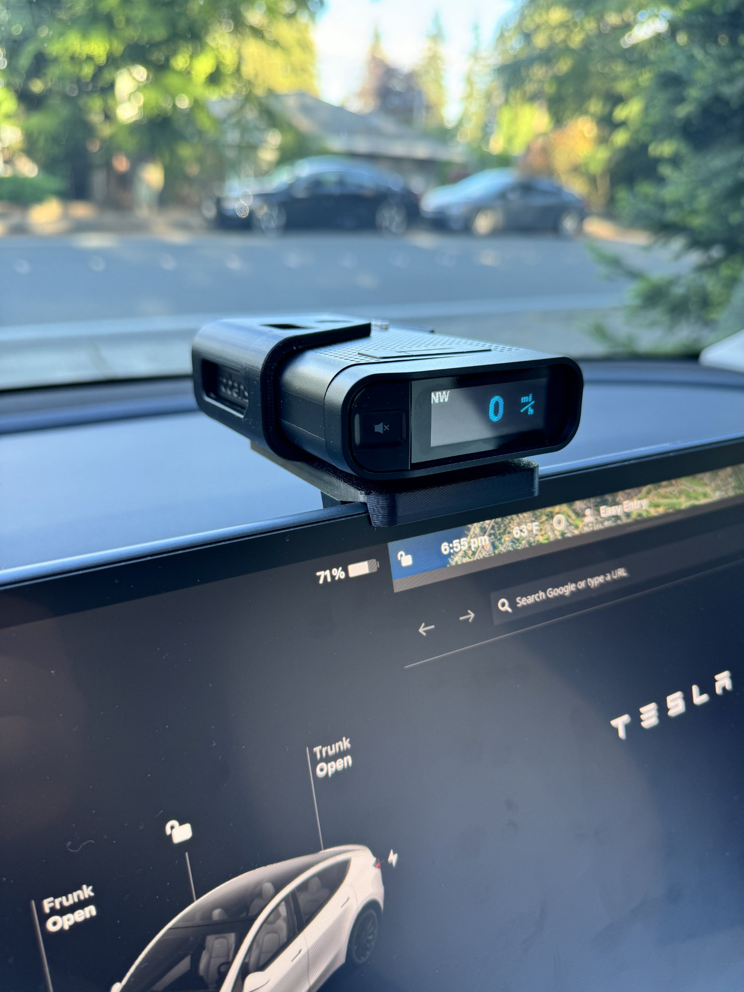 View of the Radenso DS1 installed in the bracket mounted in a Tesla