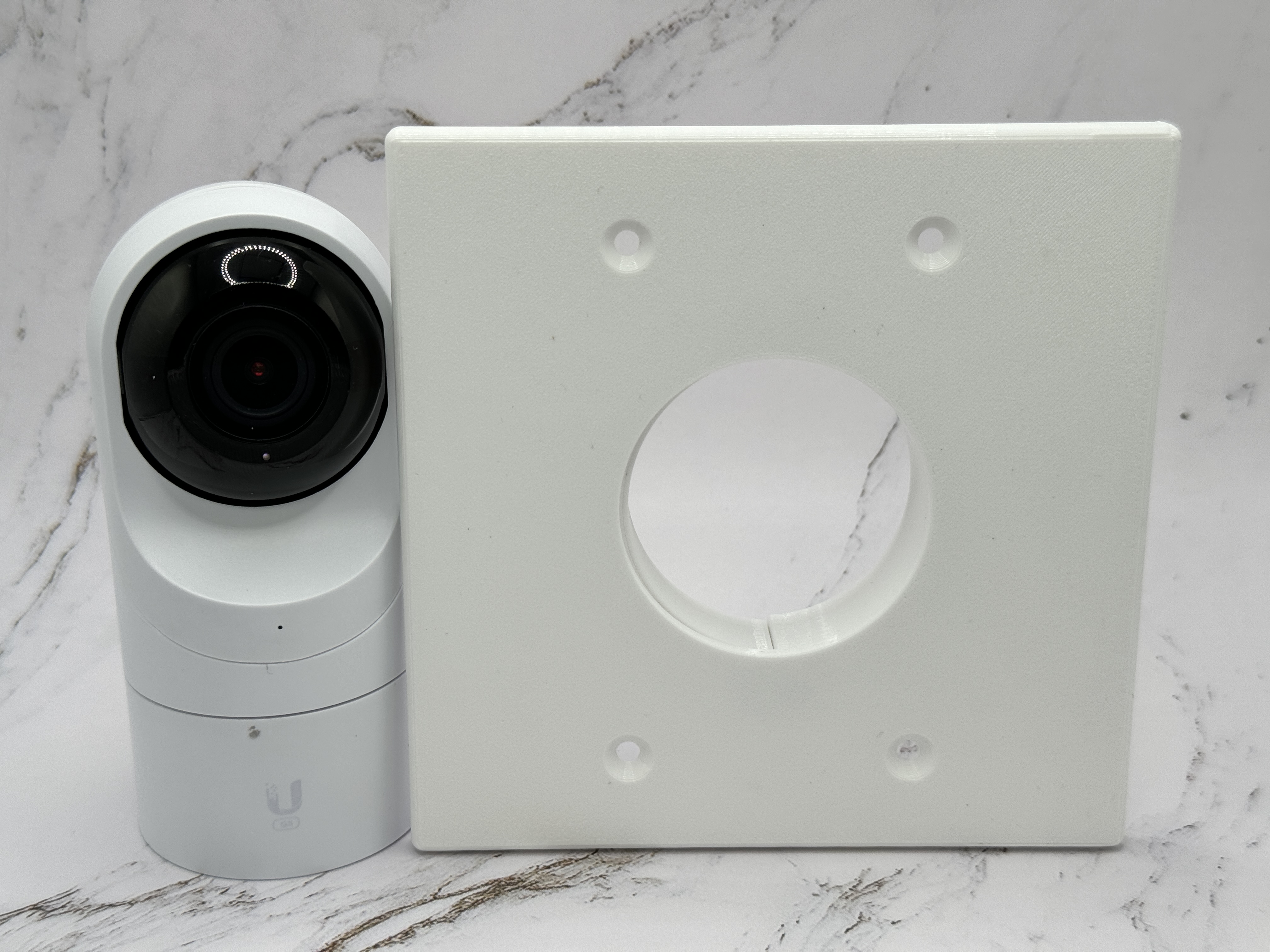 Camera Bracket standing next to a Unifi Flex G5 for size comparison