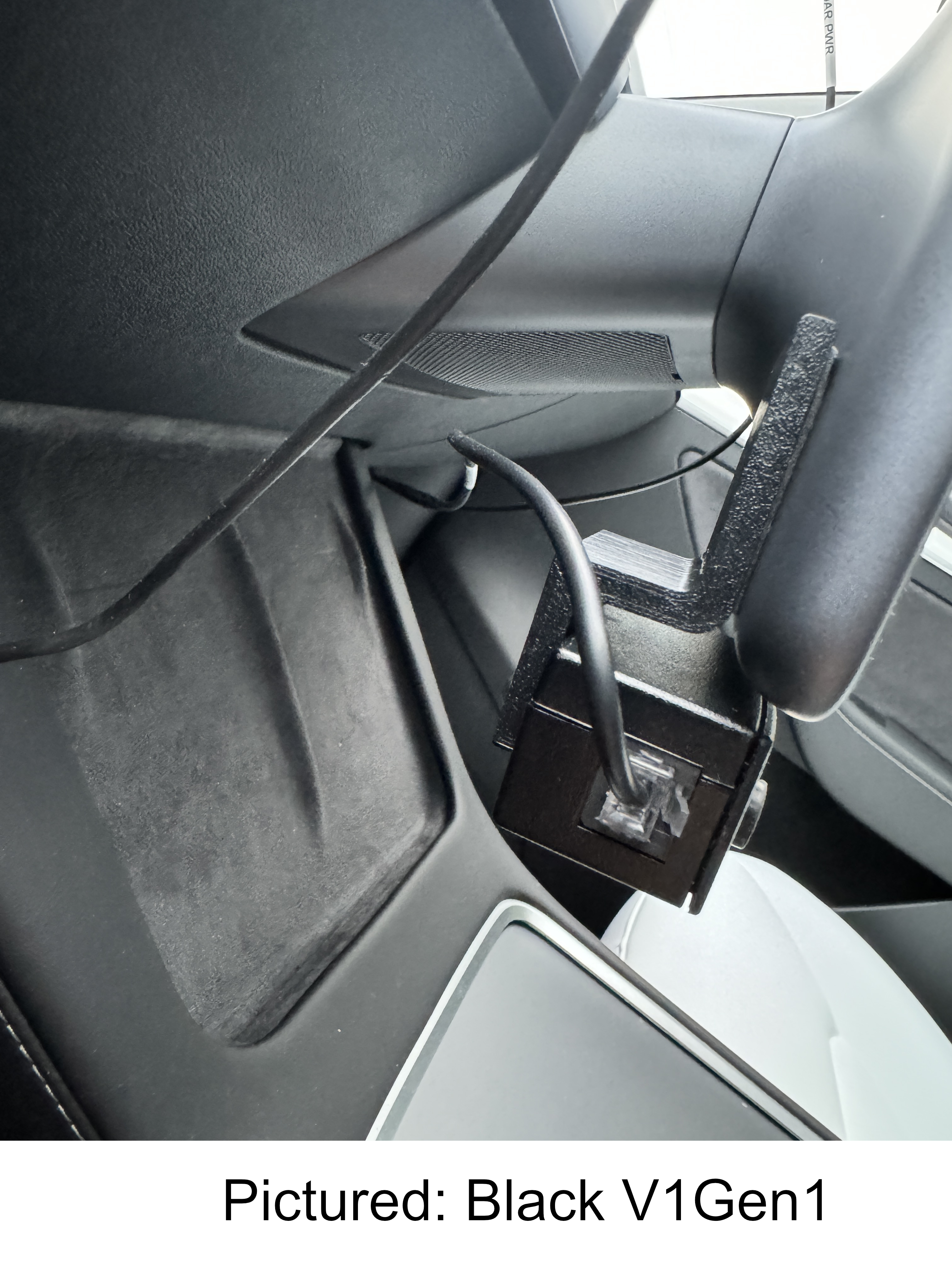 Side view of the display unit mounted on the bottom screen of a Tesla