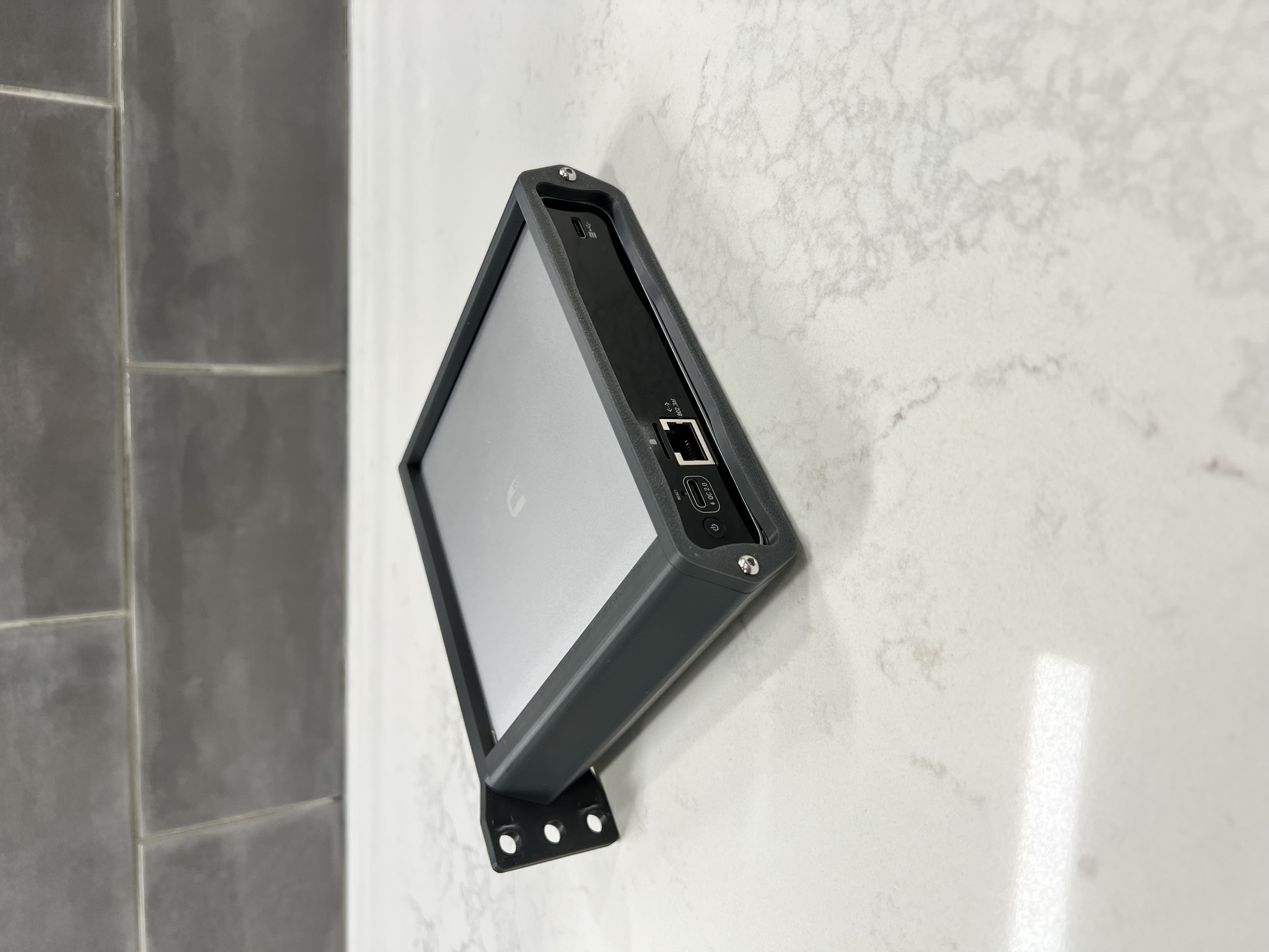 A picture of the back of a assembled unit with a Cloud Key Gen2 Plus Installed