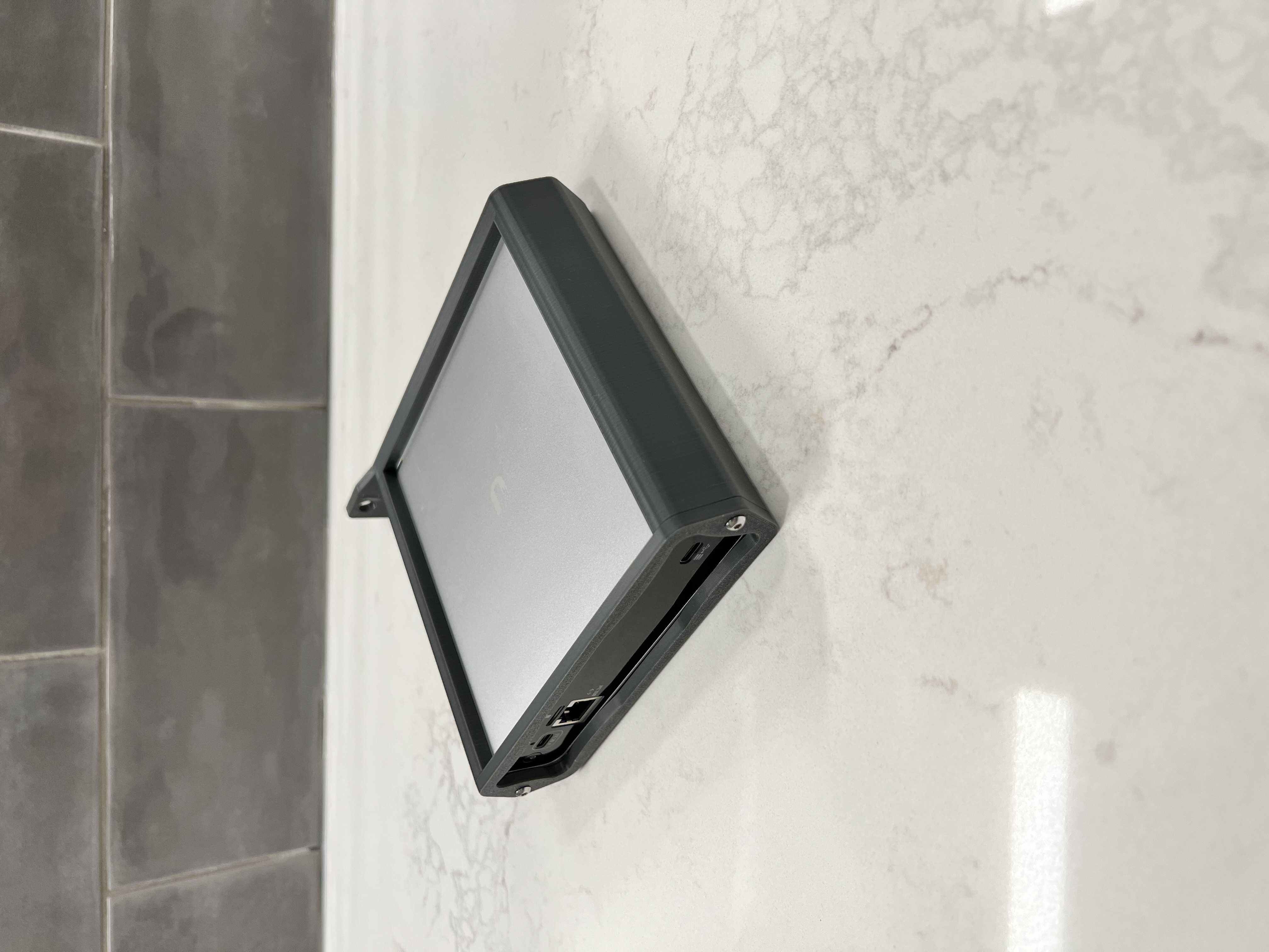 A picture of the side of a assembled unit with a Cloud Key Gen2 Plus Installed