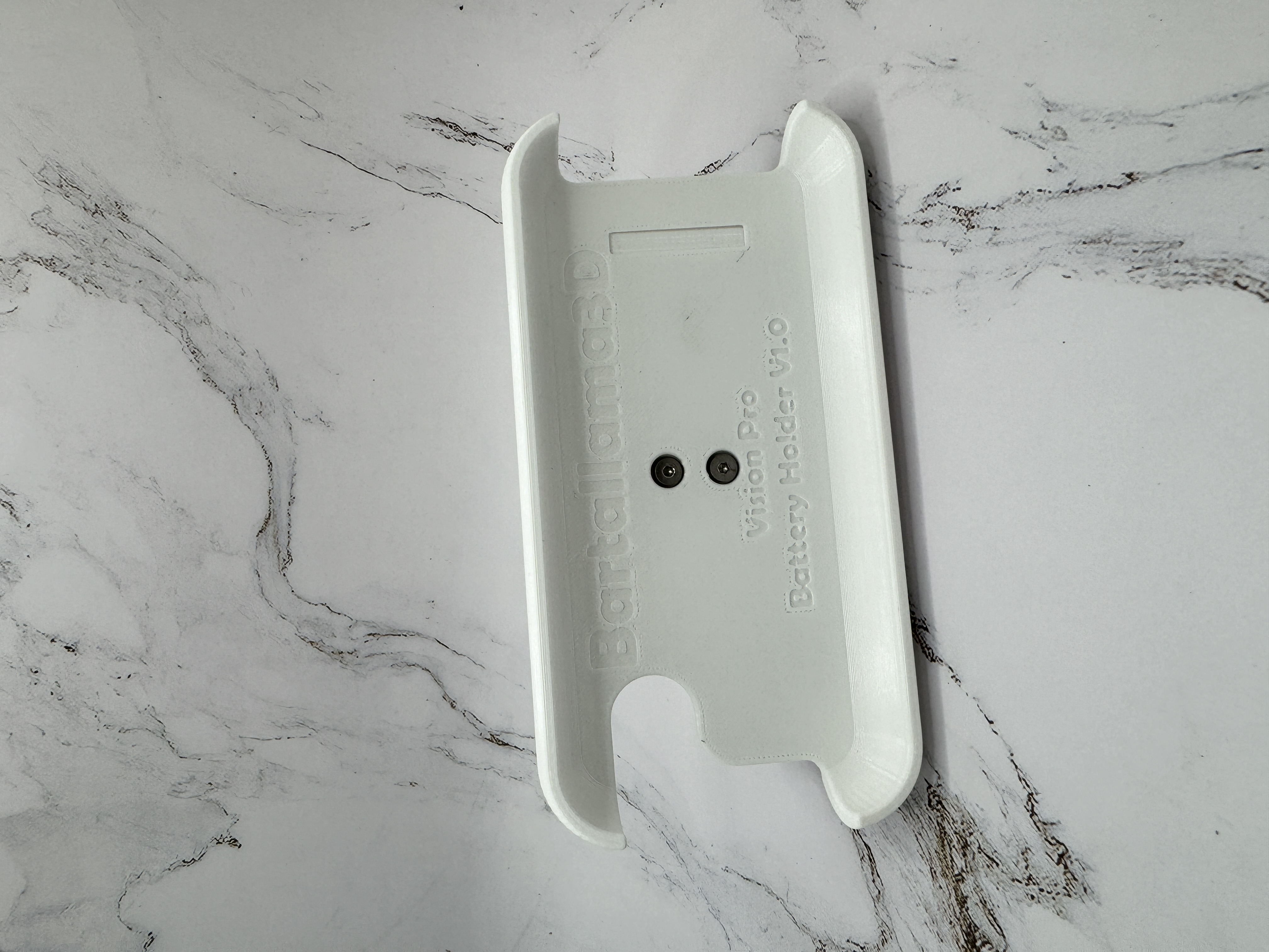 A picture of the assembled unit with no battery installed laying on its' side
