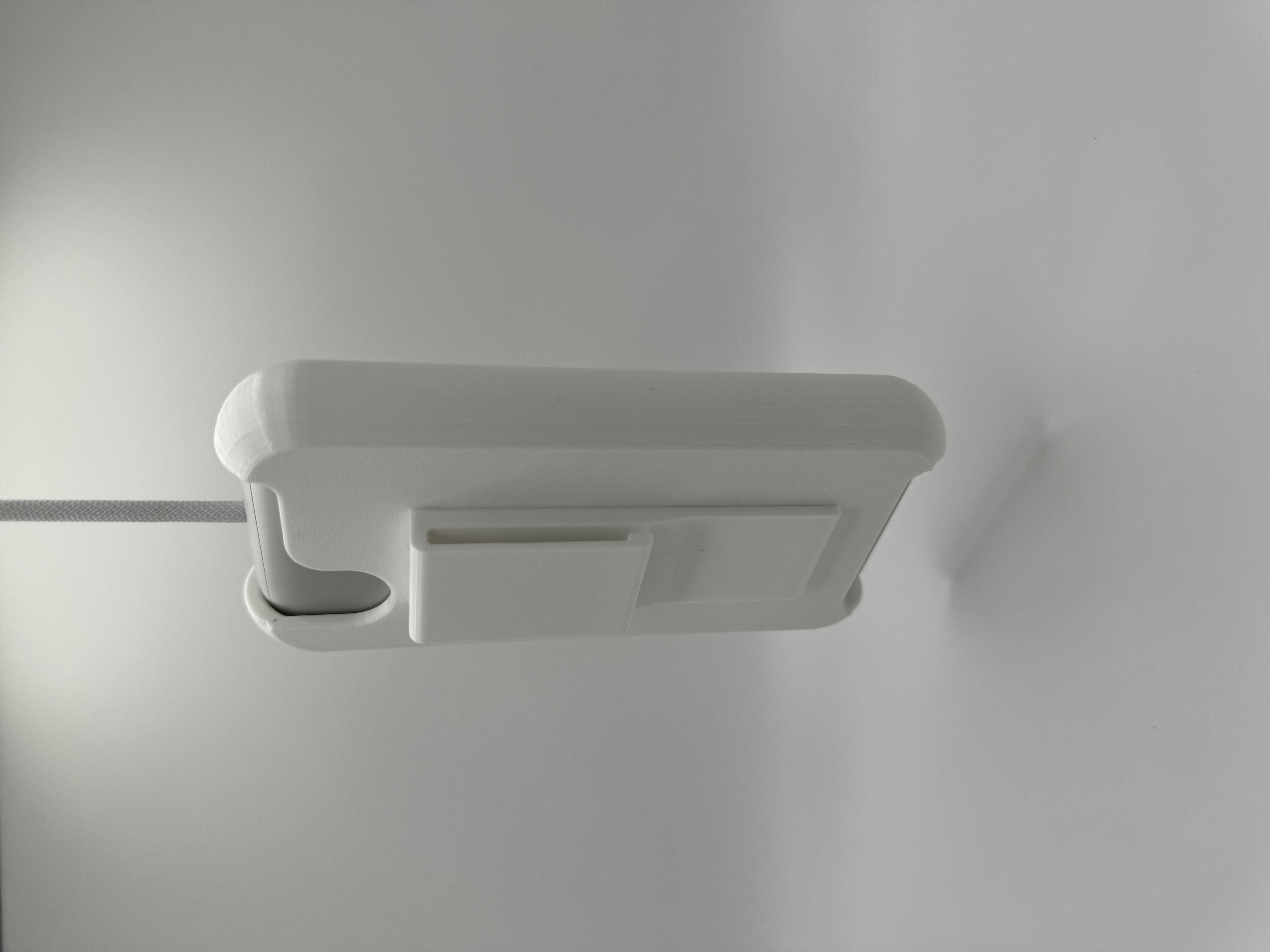 A picture of the battery holder, with battery installed, side view