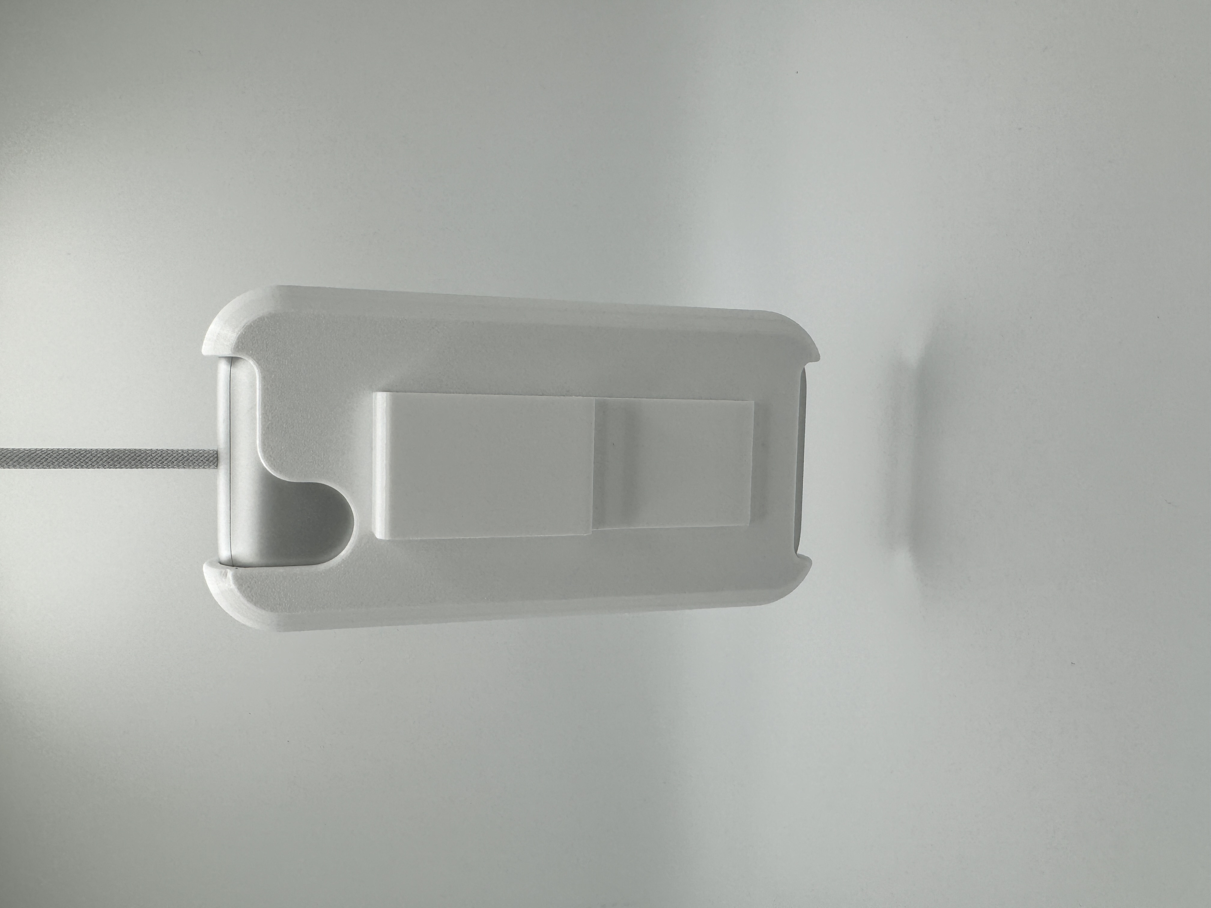 A picture of the battery holder, with battery installed, back view